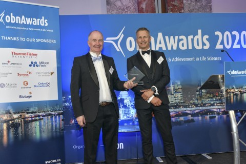 Domainex CEO Tom Mander collecting Best CRO award at OBN awards